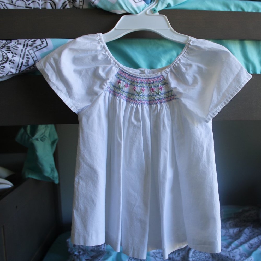 white smocked detailed top